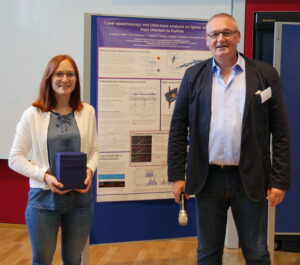 Poster award handed over by Prof. Dr. Neu.